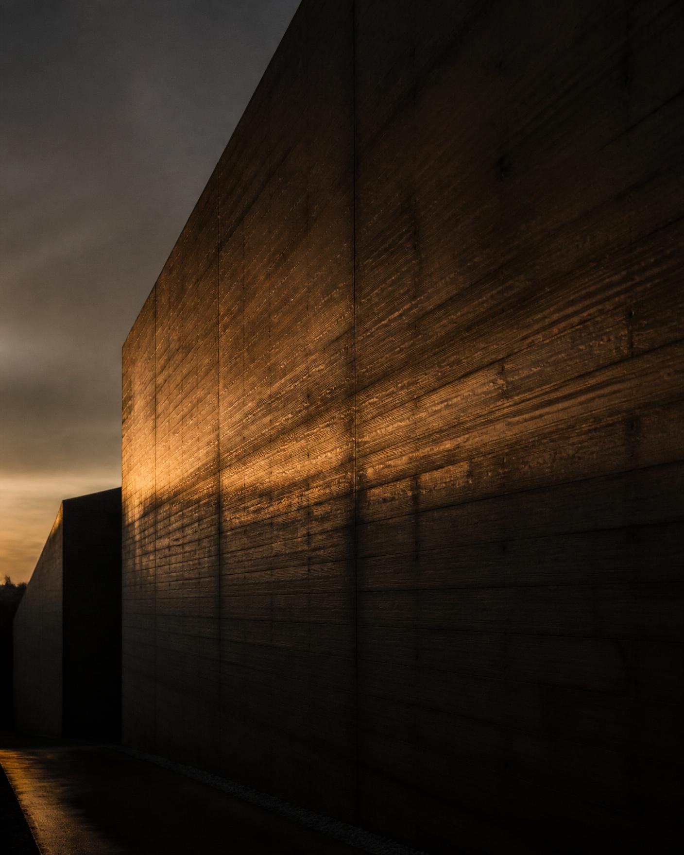 Warm afternoon light on a raw concrete wall
